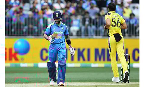 India's Virat Kohli, left, walks off after being dismissed by Australia's Mitchell Starc during the one day international cricket match between Australia and India in Perth Australia, Sunday, Oct. 19, 2025 (PTI) 