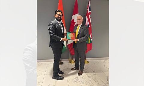 Indian Acting Consul General Kapidhwaja Pratap Singh, with Canadian Minister of Economic Development, Victor Fedeli (IANS) 