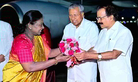 President Droupadi Murmu being received by Union Minister of State George Kurian and Kerala Chief Minister Pinarayi Vijayan upon her arrival in Thiruvananthapuram (PTI) 
