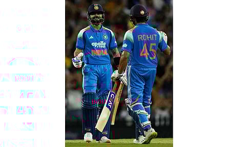 India's Rohit Sharma, right, congratulates teammate Virat Kohli after he made 50 runs against Australia during their One Day International cricket match in Sydney, Australia, Saturday, Oct. 25, 2025 (AP) 