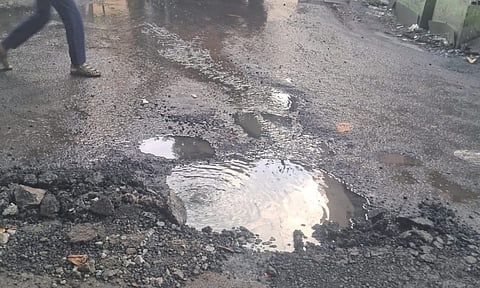 Dirty water spilling onto the Bharathipuram Main Road