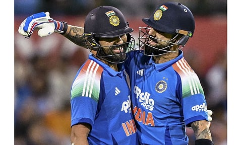Sydney: India's Rohit Sharma, left, celebrates his century with teammate Virat Kohli during the third One-Day International (ODI) cricket match between India and Australia, at the Sydney Cricket Ground, in Sydney, Australia. (Photo: PTI)