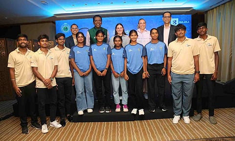 Vijay Amritraj and Sanjiv Bajaj with budding tennis players 