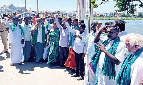 Farmers stage protest on the Cauvery bridge in Tiruchy on Wednesday