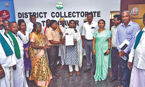 Officials of the seed testing centre hands national accreditation certificate to Thanjavur Collector Priyanka on Thursday