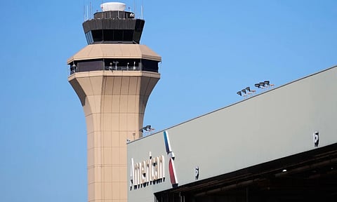 A control tower by an American Airlines hangar is shown at Dallas Fort Worth International Airport, in DFW Airport, Texas. (Photo: AP)