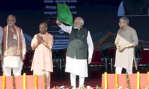 Prime Minister Narendra Modi flags off Vande Bharat Express trains at the railway station, in Varanasi. Union Railways Minister Ashwini Vaishnaw and Uttar Pradesh Chief Minister Yogi Adityanath (PTI)