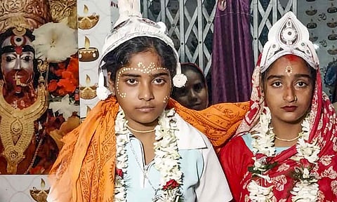 The 'wedding' of same-sex couple Riya Sardar and Rakhi Naskar being solemnised by the residents of Kultali village in West Bengal's Sundarbans (PTI) 
