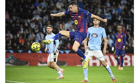 Robert Lewandowski beats the offside trap to flick the ball into the net for his second goal 