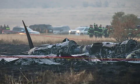 Debris is seen at a crash site of a Turkish military cargo plane in Georgia's Sighnaghi municipality, close to the Azerbaijani border (AP)