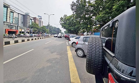 Cars occupying most of a lane on Third Avenue in Anna Nagar 