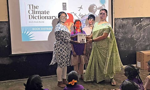 Dictionary being handed over to a teacher on Saturday