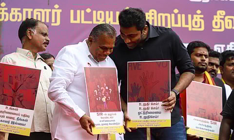 TVK General Secretary Bussy Anand, along with party cadres, staged a protest in Chennai on Sunday opposing the Election Commission of India’s Special Intensive Revision (SIR) drive at Sivananda Salai. (Hemanathan M)