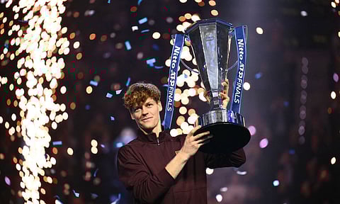 Jannik Sinner celebrates with the trophy