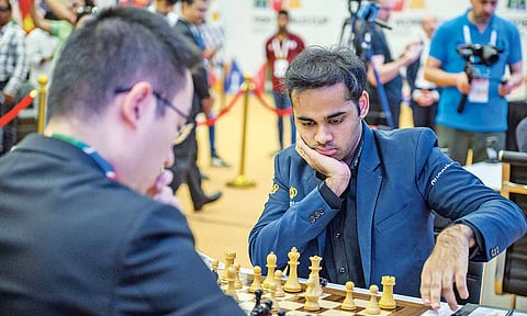 Grandmaster Arjun Erigaisi is seen thinking before moving a piece during his game
