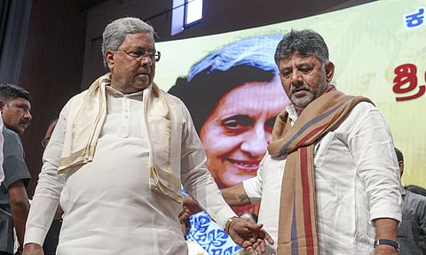 Bengaluru: Karnataka Chief Minister Siddaramaiah and state Deputy Chief Minister DK Shivkumar during an event marking the birth anniversary of former PM Indira Gandhi, at Bharat Jodo Bhavan in Bengaluru, Wednesday, Nov. 19, 2025. (PTI) 