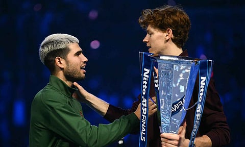 Jannik Sinner acknowledges Carlos Alcaraz after the trophy presentation ceremony at the ATP Finals 