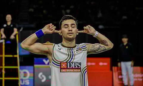 Lakshya Sen gestures with a ‘hands over ears’ celebration after his title win, symbolically shutting out the doubters 