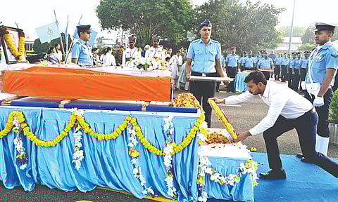 Coimbatore Collector Pavan Kumar places a wreath on the mortal remains of IAF Wing Commander Namansh Syal at Sulur Air Force Station on Sunday