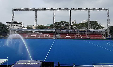 Pitch being watered at the Chennai Hockey stadium 