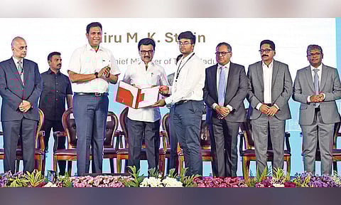Chief Minister MK Stalin handing over an appointment order to a recruit at the TN Rising conclave in Coimbatore on Tuesday