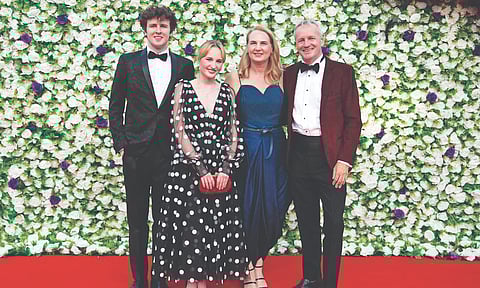 Natasha Conlon (navy blue dress) with her family