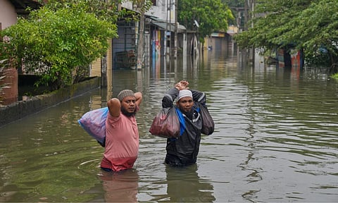 Flood victims wade through water in Colombo, Sri Lanka, Saturday, Nov, 29, 2025. (AP)