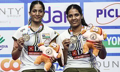 Gayatri Gopichand and Treesa Jolly poses with the doubles gold medal (PTI) 