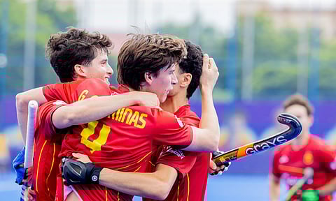 Spain players celebrate after scoring