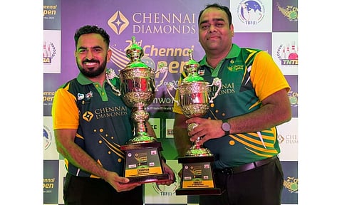 Mahipal Singh and Benigopal L with the trophies 