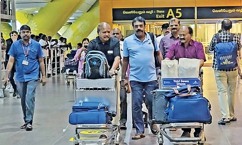 Tourists back from flood-hit Lanka at the Chennai airport