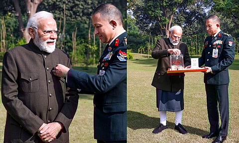 In this image posted on Dec. 7, 2025, Prime Minister Narendra Modi contributes to the Armed Forces Flag Day fund. (PTI)