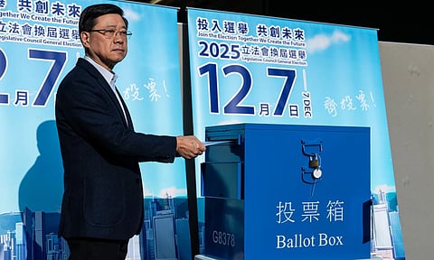 Hong Kong’s Chief Executive, John Lee casts his ballot at a polling station during the Legislative Council General Election in Hong Kong. (Photo: AP)