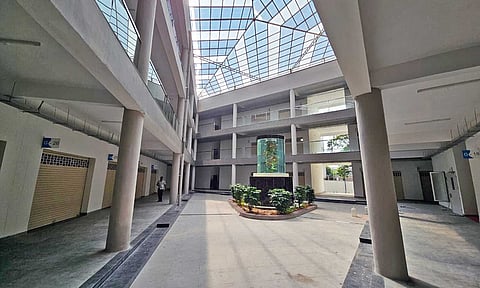Rows of shops with closed shutters at the Kolathur centre