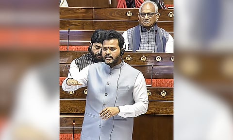 Union Minister for Civil Aviation K Rammohan Naidu speaks in the Rajya Sabha regarding the IndiGo flight crisis, during the Winter session of Parliament, in New Delhi, Monday, Dec. 8, 2025. (PTI) 