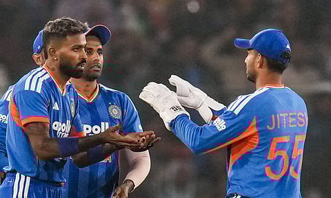 India's Hardik Pandya celebrates with Jitesh Sharma after taking the wicket of South Africa's David Miller during the first T20I cricket match between India and South Africa at Barabati Stadium (PTI)