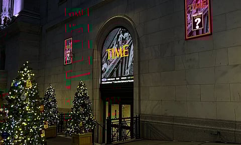 A sign for Time magazine is displayed outside the New York Stock Exchange on Thursday, Dec. 11, 2025 in New York. (AP) 
