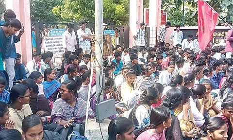 Students of Karur Government Arts College stage protest at the college entrance on Friday