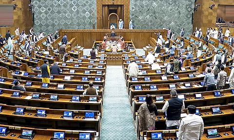  BJP MP Dilip Saikia presides over the Lok Sabha amid a protest by opposition leaders during the Winter session of Parliament