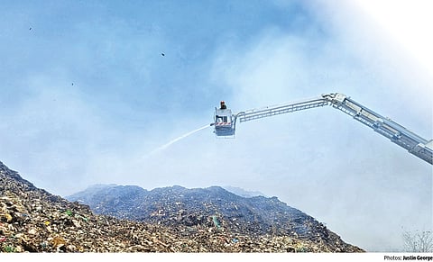 A firefighter working through the toxic haze in Perungudi dumpyard