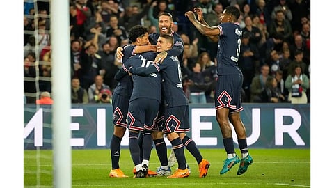 Lionel Messi, number 10, is mobbed by his team-mates after scoring Paris St Germain?s opening goal against Lens (Image: AP)
