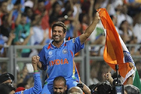 Sachin Tendulkar is carried by his teammate Yusuf Pathan after they beat Sri Lanka in the ICC Cricket World Cup final match in Mumbai April 2, 2011