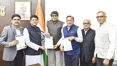 Delegation handing over to Union Minister of Textile and Commerce Piyush Goyal