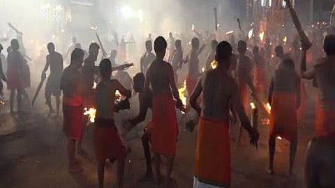 Devotees throw burning fronds at each other in 'Agni Kheli' festival (Photo/ANI)
