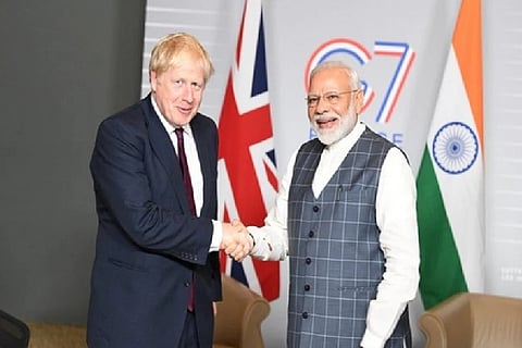 Prime Minister Narendra Modi (L) and his UK counterpart Boris Johnson