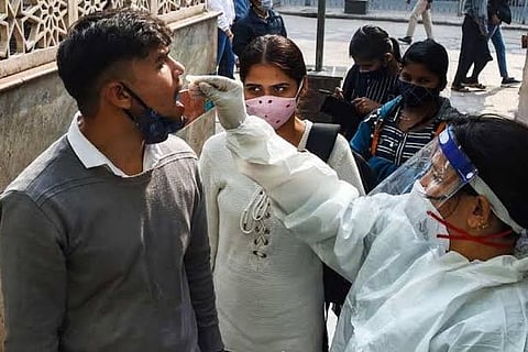 A health worker taking a Covid sample from a person