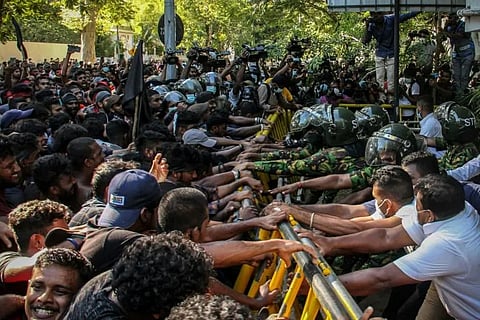 Thousands of Sri Lankan univ students mobbed PM's home on Sunday demanding his resignation over the island nation's worsening economic crisis.