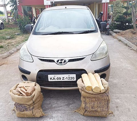 The seized vehicle and sandalwood logs