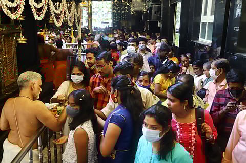 People saw their faces on a mirror kept and offered prayers at Ayyappan Temple, Mahalingapuram to mark the 'Vishu? festival( Malayali New Year).