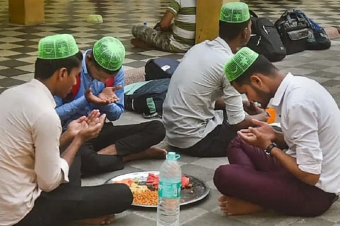 Muslims offer prayers before breaking their day long fast during holy month of Ramadan, at a Mosque in Kolkata, Sunday, April 3, 2022. Islam?s holiest month is the period of intense prayer, dawn-to-dusk fasting and nightly feasts.